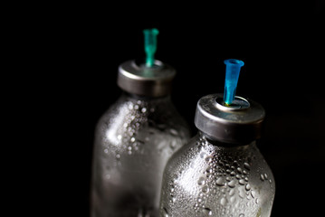 medicine bottle on black background