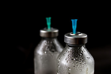 medicine bottle on black background