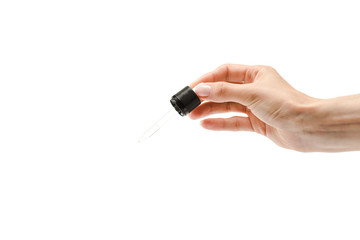 cropped view of woman holding pipette with liquid isolated on white