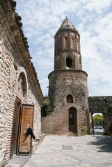Ancient stone tower in the Georgian city of Sighnaghi, ancient architecture, Georgian attractions,