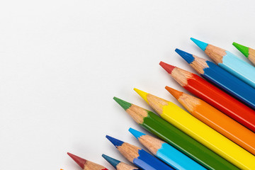 Set of colored pencils. Colors of rainbow. Colored pencils for drawing different colors on a white background.