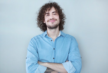 Fototapeta premium Portrait of an handsome young man smiling.Confidence and business concept.