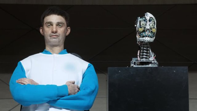 Humanoid robot man on stage. Innovative development in robotics and artificial intelligence. Android Presentation. Modern Robotic Technologies. The robot shows emotions.