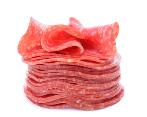 Salami slice in stack isolated on white