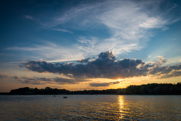 Sunset over lake on a beautiful summer evening. Turawa lake Poland