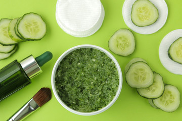 Face mask with cucumber. Cosmetics with cucumber extract on a bright green background. spa. beauty.