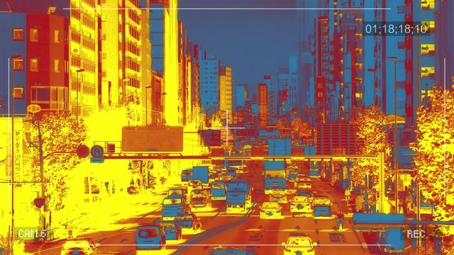 Infrared CCTV camera filming cars traffic in a city. Roads surveillance monitoring concept