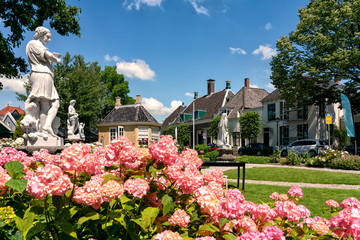 View of the beautiful dutch houses and the statue garden at Zaandijk, Netherlands
