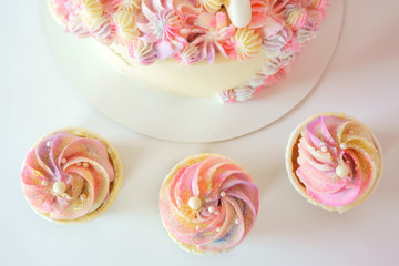 Fototapeta na wymiar tasty cake and cupcakes for kids, birthday