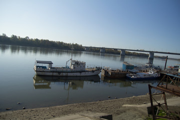 old ship, on the river bank. beautiful river landscape in a bright sunny day