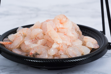 Shrimp cocktail background with a close up view of a group of fresh delicious refrigerated...