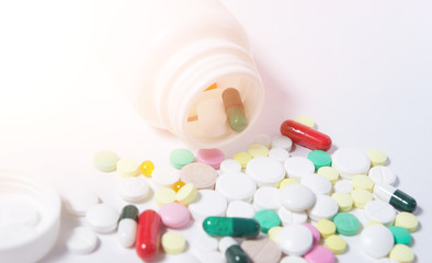 Various medicines and vitamins, a bottle of pills. place to insert text. Health. Assortment of pills and capsules medication isolated on white background