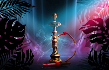 Smoking hookah on a dark abstract background, neon light. Silhouettes of tropical palm leaves in the foreground.