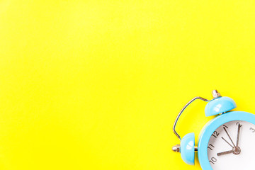 Ringing twin bell vintage classic alarm clock Isolated on yellow colourful trendy modern...