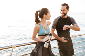 Attractive sporty young fitness couple