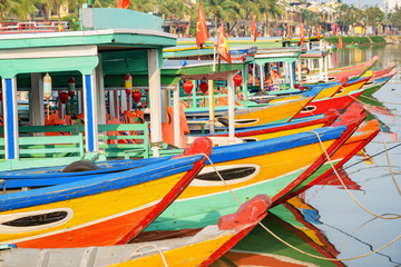 Fototapeta na wymiar Wonderful view of colorful traditional Vietnamese tourist boats