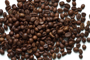 coffee beans brown on white isolated background with close-up location with blurred background