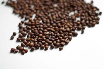 coffee beans brown on white isolated background with close-up location with blurred background