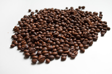 coffee beans brown on white isolated background with close-up location with blurred background