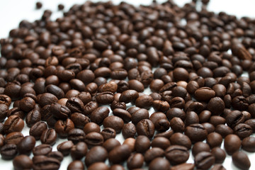 coffee beans brown on white isolated background with close-up location with blurred background