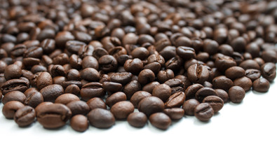 coffee beans brown on white isolated background with close-up location with blurred background