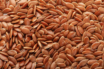Brown flax seeds background texture