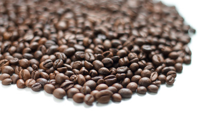coffee beans brown on white isolated background with close-up location with blurred background