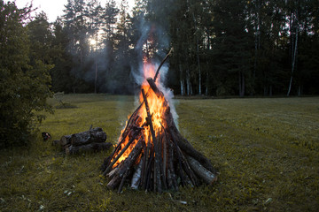 Big bonfire in countryside.