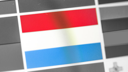 Luxembourg national flag of country. Luxembourg flag on the display, a digital moire effect.