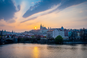 Fototapeta premium Scenic Panorama of the Old Town Architecture with Vltava River, Charles Bridge and St.Vitus Cathedral in Prague, Czech Republic, Sunset Time