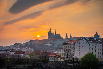 Obraz premium Scenic Panorama of the Old Town Architecture with Vltava River, Charles Bridge and St.Vitus Cathedral in Prague, Czech Republic, Sunset Time