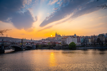 Fototapeta na wymiar Scenic Panorama of the Old Town Architecture with Vltava River, Charles Bridge and St.Vitus Cathedral in Prague, Czech Republic, Sunset Time