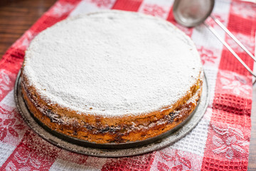 Homemade Rhubarb and Apple Pie with Icing Sugar on the Red Towel