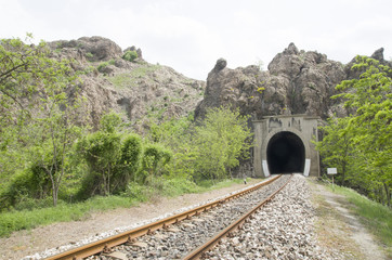 Fototapeta na wymiar Railroad tunnel and rails in the mountain in Bulgaria