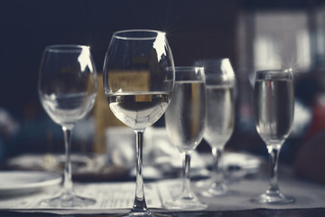 Glasses of  white wine on the table in the restaurant