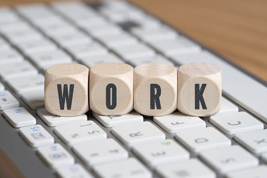 cubes with the word "WORK" on a computer keyboard