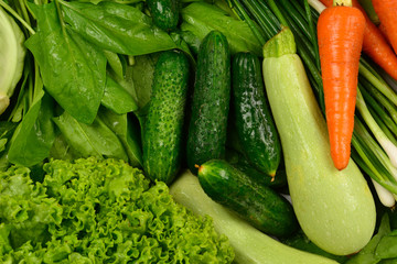 Fresh vegetables and herbs as a background.