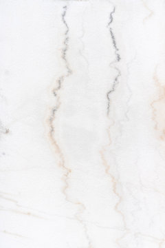 texture of white limestone with dark streaks. Very beautiful background. Abstract pattern for the screen. © Денис Бухлаев