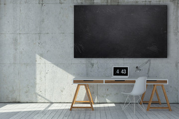 Small neat minimalist monochromatic grey office with blank cleaned chalkboard above a modern desk and chair with digital clock