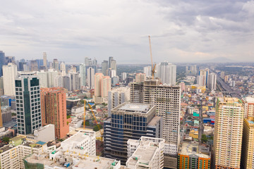 Modern city. The city of Manila, the capital of the Philippines. Modern metropolis in the morning, top view. Modern buildings in the city center.