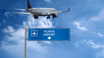 Plane landing in Vilnius with signboard