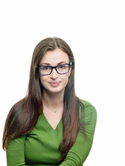 Obraz premium oung woman portrait. Long hired brunette female model in eyeglasses and green blouse looking at camera. Vertical shot. Studio image isolated on white. 