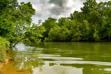 River Bank with Storm Clouds Overhead