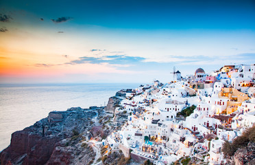 amazing view of Oia town at sunset in Santorini, Cyclades islands Greece - amazing travel destination - obrazy, fototapety, plakaty