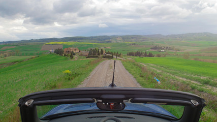A car cabriolet riding in the Italy, Toskana.