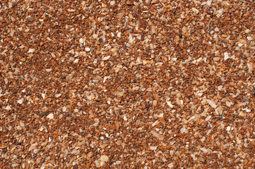 Sand grains white-brown, sand crumb, brown background