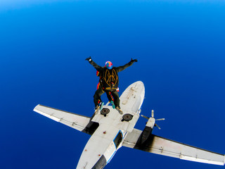 Parachute jump from an airplane in tandem with an instructor.