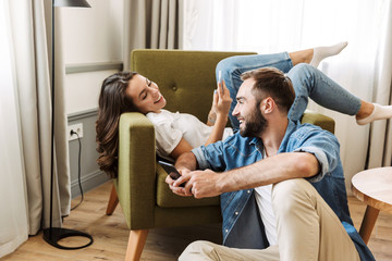 Beautiful young couple in love at home