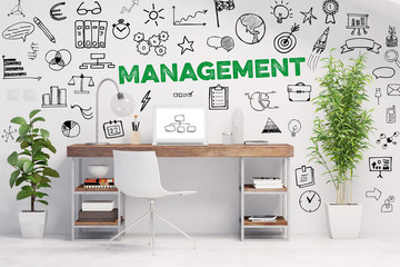Management Konzept mit Slogan an grünem Arbeitsplatz