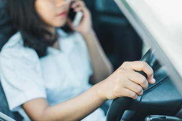 transportation and vehicle concept - man using phone while driving the car